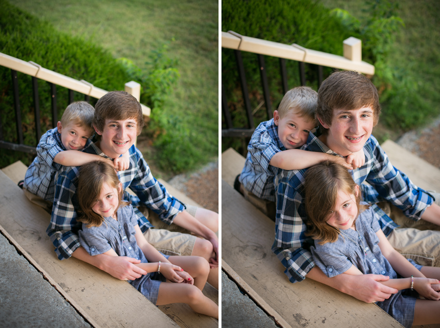siblings sitting together on stairs of pavilion in frontier park