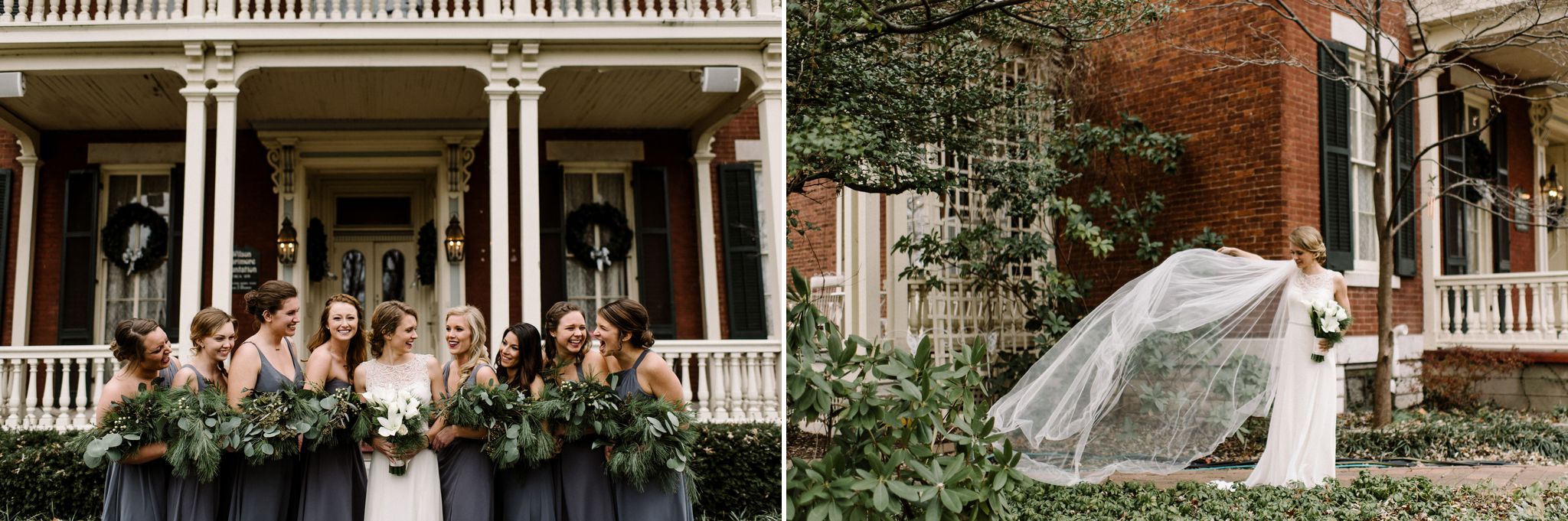 A bride stands in front of the Larimore House. Her long veil is blowing out to the side. She is looking at the veil.