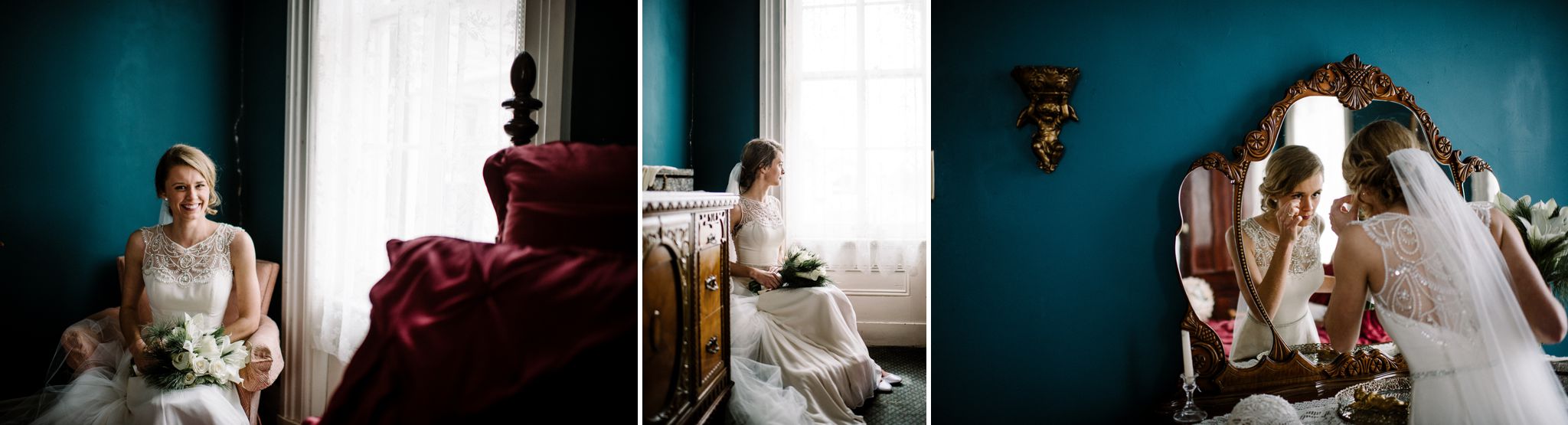 A bride is looking in a mirror and putting lipstick on.