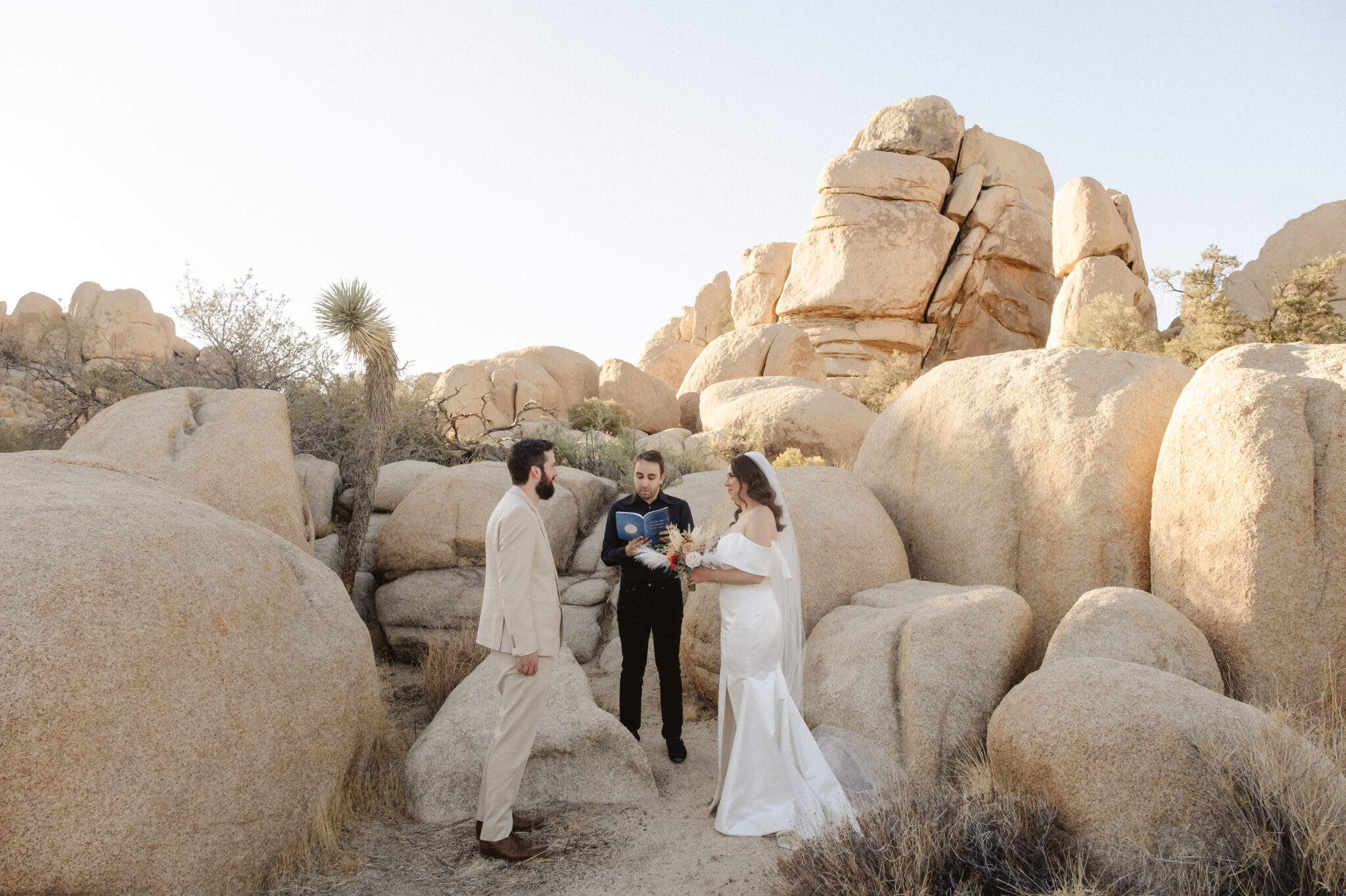 Couple getting married in Joshua Tree National Park during an intimate desert ceremony